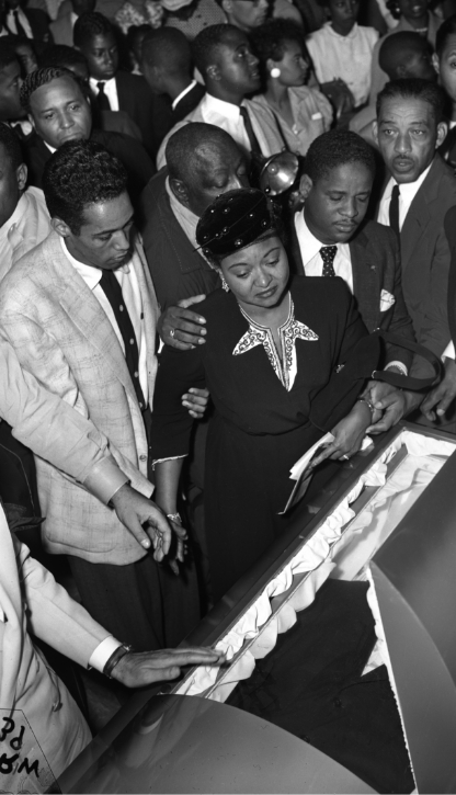 Black and white photo of Mamie Till-Mobley next to Emmett Till's casket